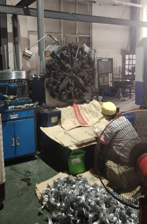 CNC spring coiling machine in operation at the Sujie Hardware factory