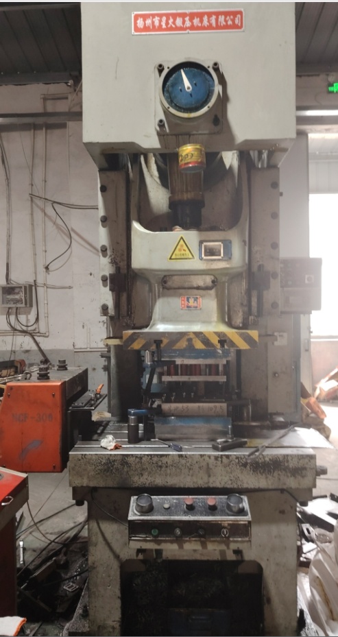Stamping press in operation on the Sujie Hardware production floor